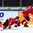 HELSINKI, FINLAND - DECEMBER 30: Switzerland's Tino Kessler #22 falls to the ice with Switzerland's Marco Forrer #9 during preliminary round action at the 2016 IIHF World Junior Championship. (Photo by Matt Zambonin/HHOF-IIHF Images)

